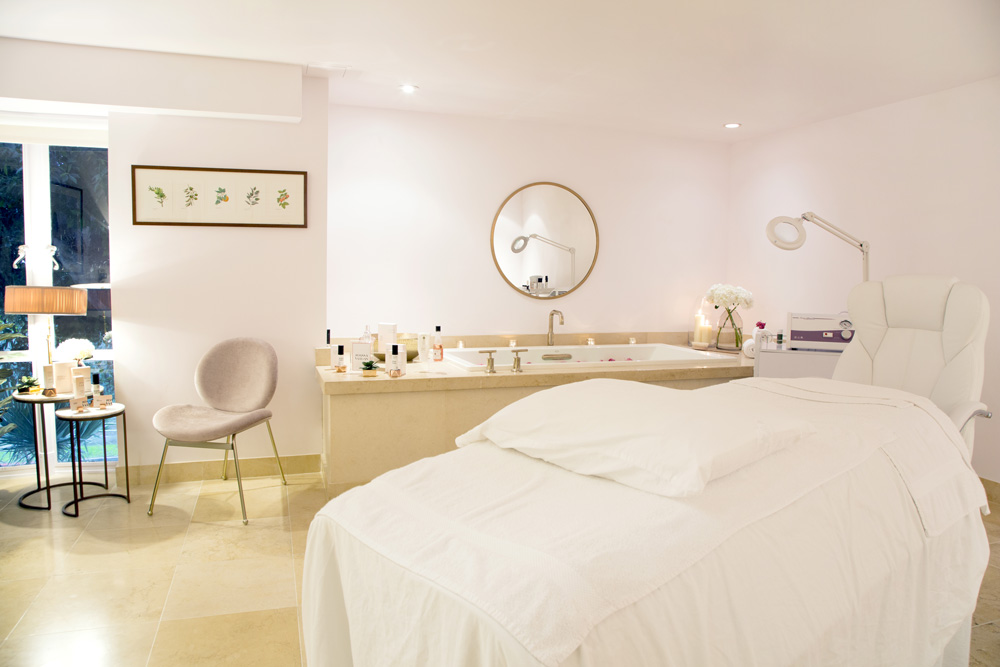 Interior of Joanna Vargas Spa in West Hollywood, California. A bright, airy room with white walls and minimalistic furniture.