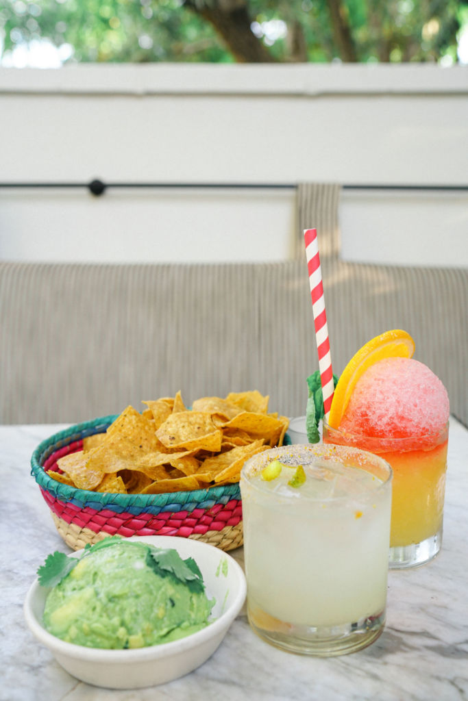 Food and drinks on a table at Gracias Madre in West Hollywood, California