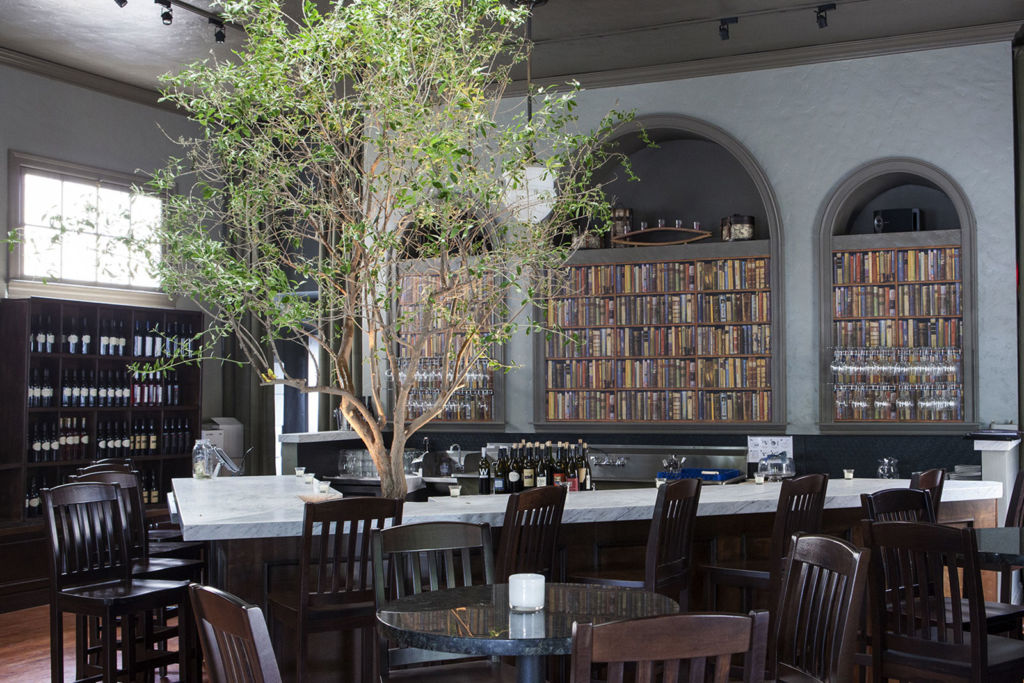 Interior of V Wine Room, with a live tree growing in the center of the room. West Hollywood, CA.