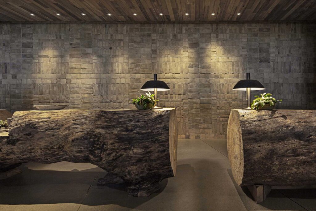 The check-in desk at 1 Hotel West Hollywood, which is carved from two huge tree trunks.