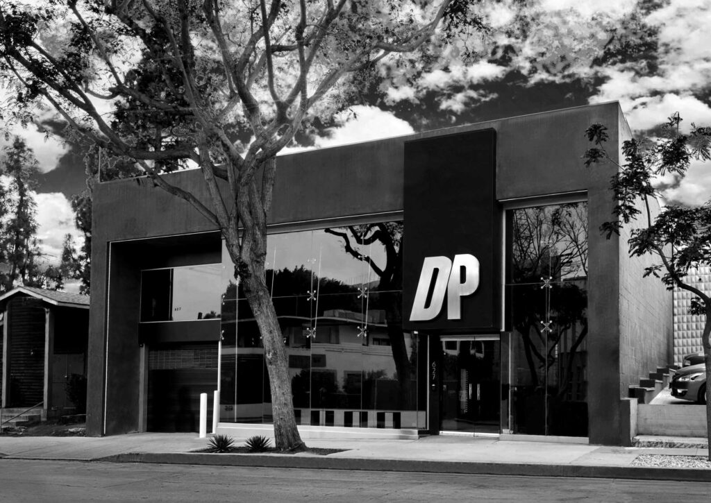 Exterior of DOGPOUND gym in West Hollywood, CA, with a tall tree out front.