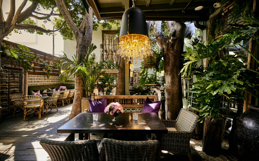 The jungle-like garden dining area of Lisa Vanderpump's SUR Restaurant and Lounge. West Hollywood, CA.