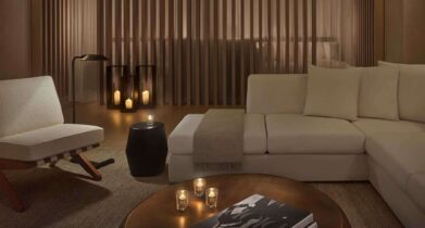 Relaxation room at The Spa at The West Hollywood Edition, with white sofas, minimalist chairs and soft lanterns.