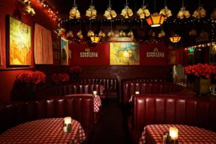 Red leather booths inside the dim interior of Dan Tana's in West Hollywood