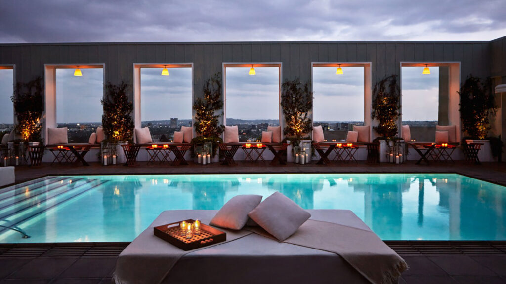 The Mondrian Hotel rooftop pool, illuminated at twilight.