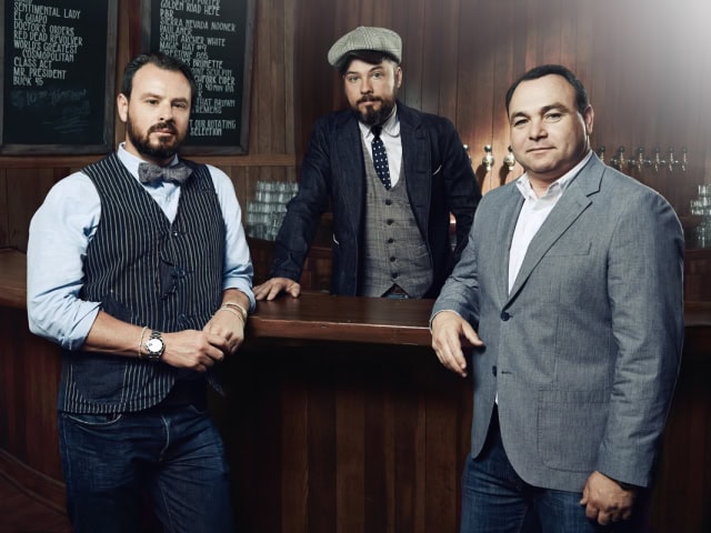 Dimitri Komarov, Bobby Green and Dimitry Liberman, owners of the 1933 Group, pose in retro-styled suits.