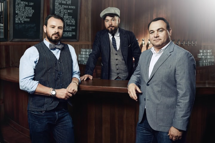 Dimitri Komarov, Bobby Green and Dimitry Liberman, co-owners of the 1933 Group, dressed in retro suits.