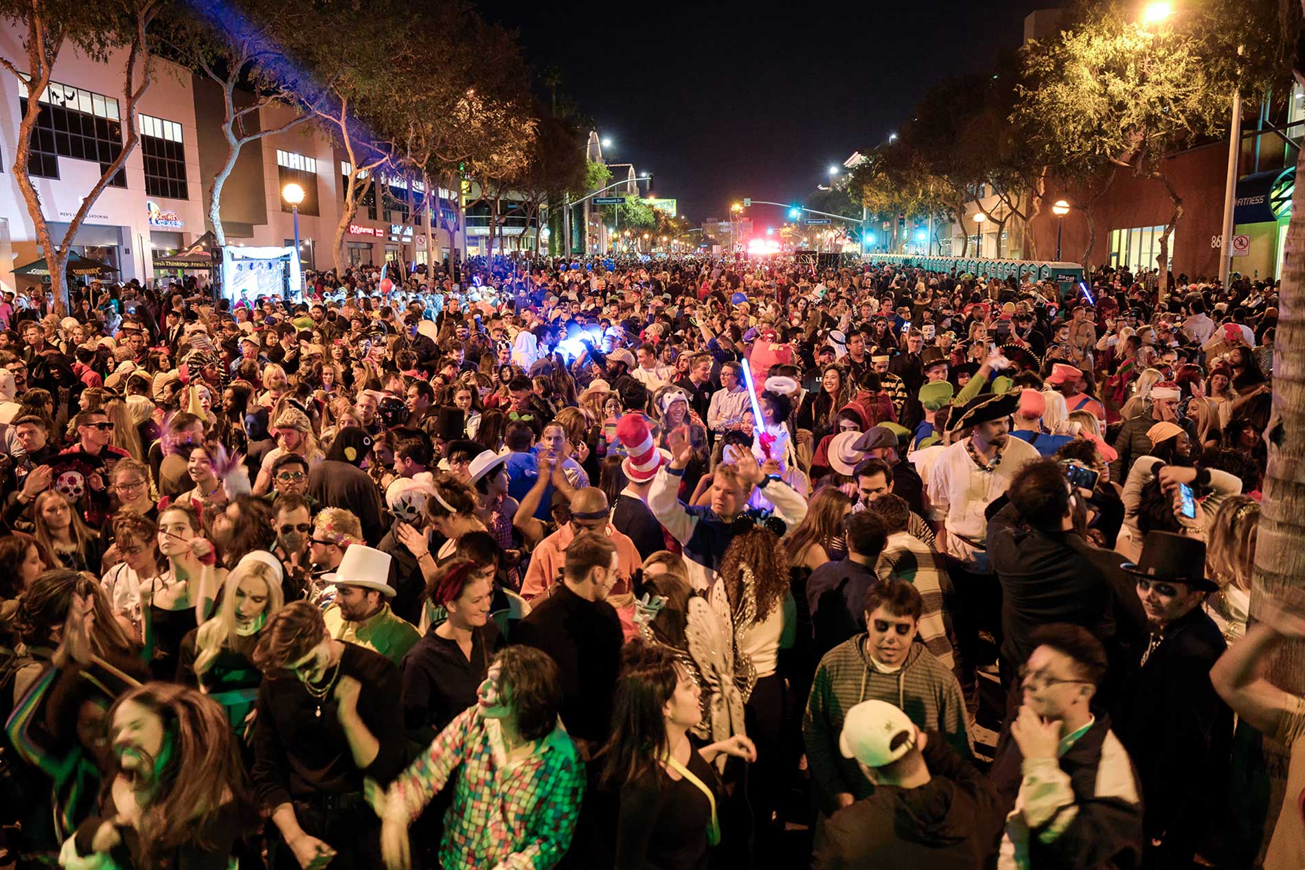 A huge crowd of costumed revelers gathers on Santa Monica Boulevard for the annual West Hollywood Halloween Carnaval.