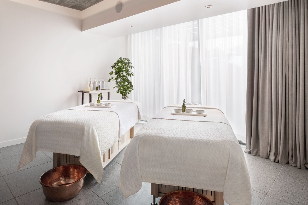 Two massage beds in a light-filled room at Bamford Wellness Spa in West Hollywood