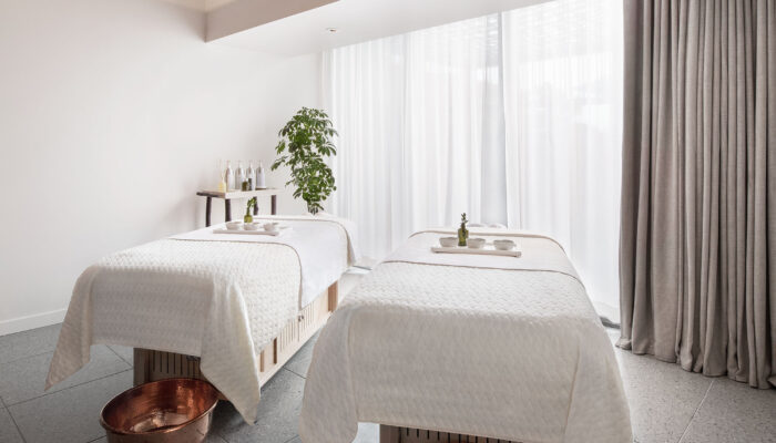 Two massage beds in a light-filled room at Bamford Wellness Spa in West Hollywood