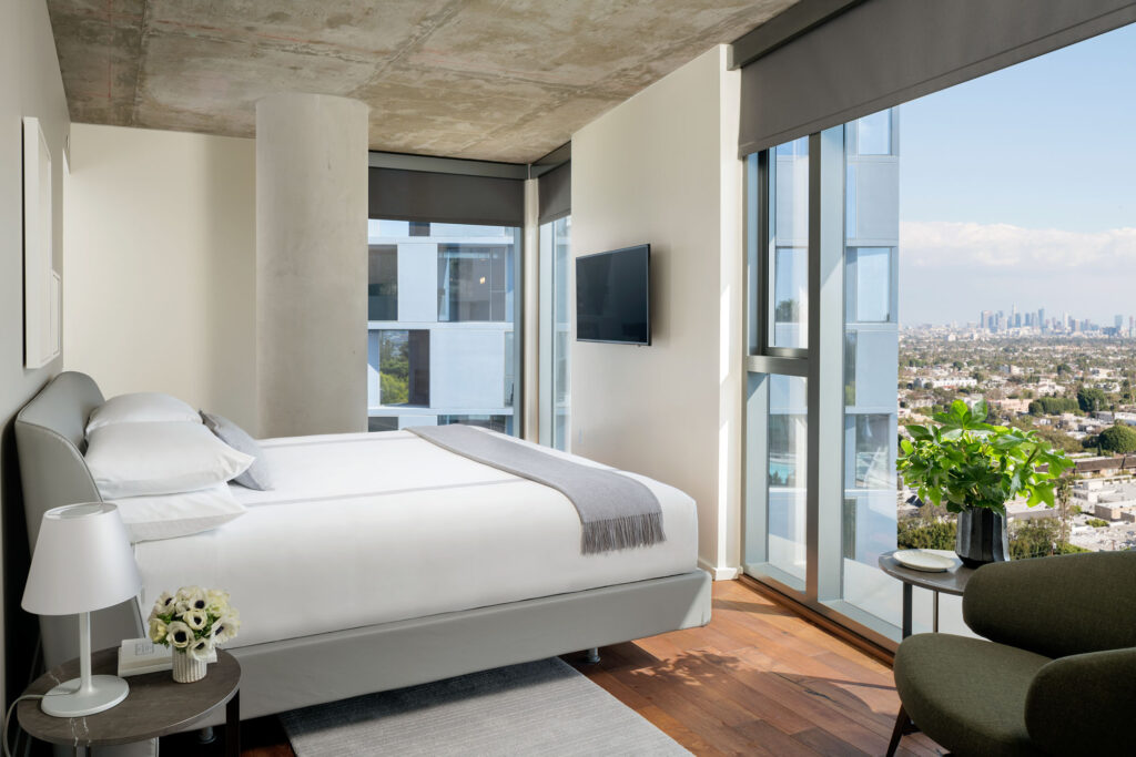 Minimalist suite at AKA West Hollywood overlooking the LA skyline.