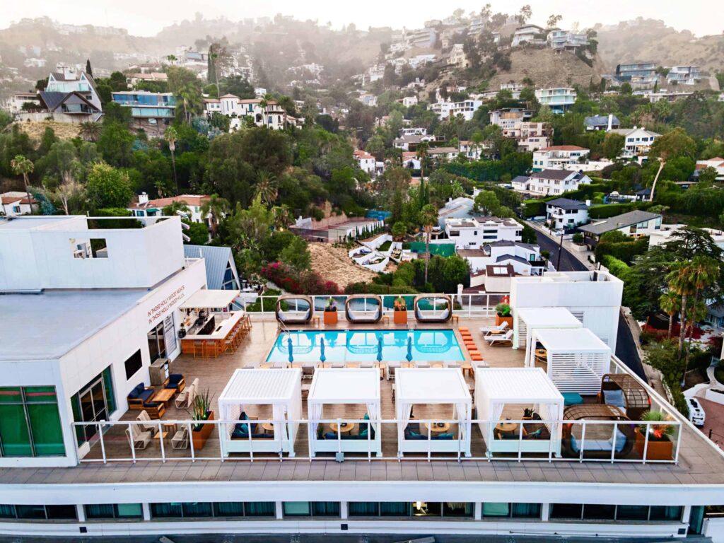 Overhead view of the Andaz West Hollywood rooftop, with the Hollywood Hills in the background.