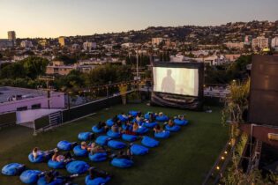 Aerial shot of Melrose Rooftop Theatre with the Hollywood Hills in the background. West Hollywood, California.