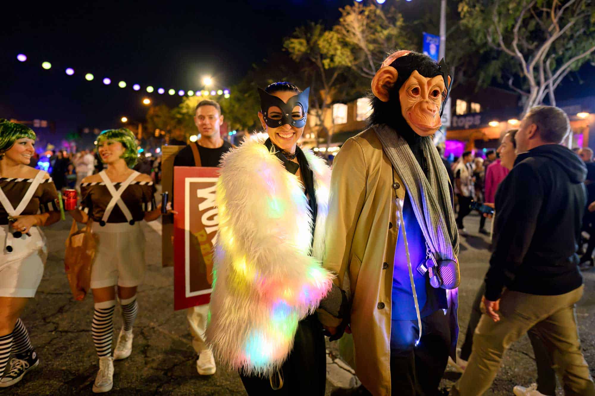 A couple in costumes enjoys the West Hollywood Halloween Carnaval.