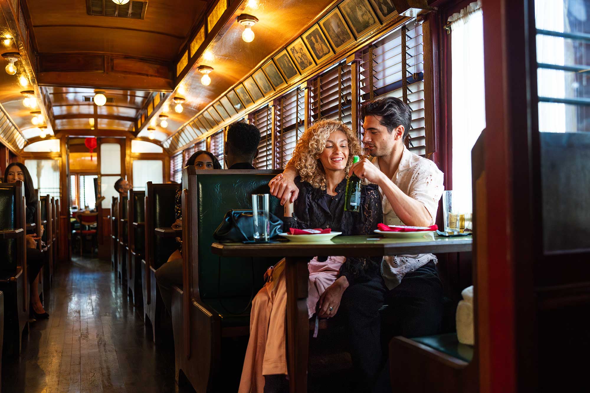 A couple shares a drink inside The Formosa Cafe