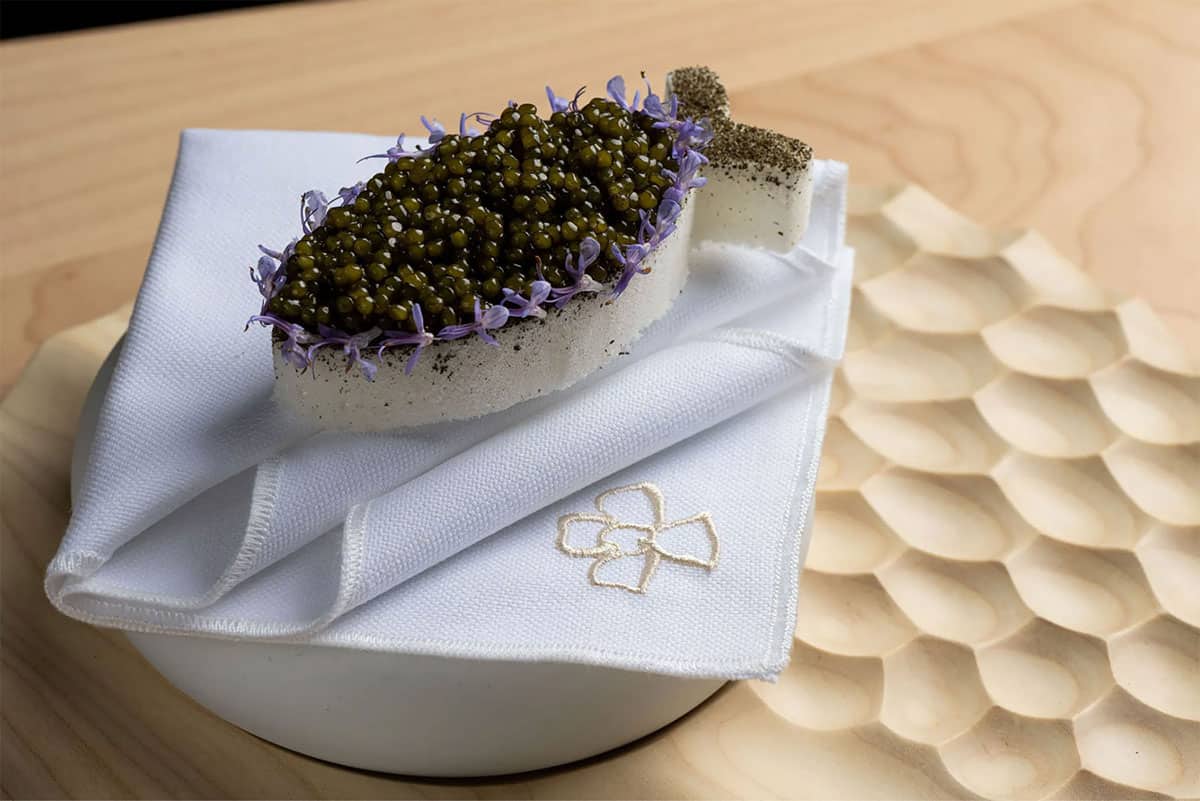 Caviar plated on a napkin at the restaurant Somni in West Hollywood