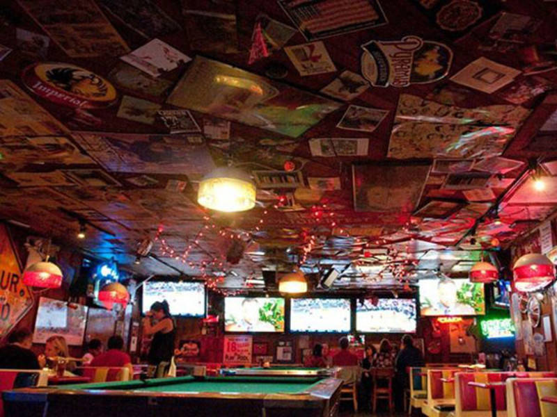 The interior of Barney's Beanery, with roadhouse-style decor and unpretentious ambiance.