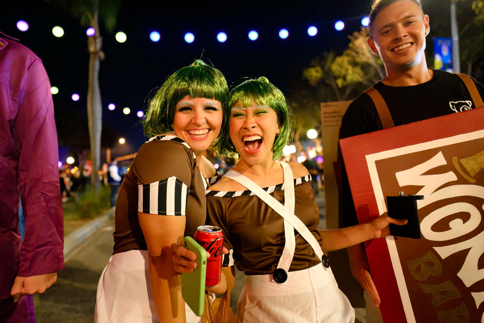 Two women in Oompa Loompa costumes pose at the West Hollywood Halloween Carnaval