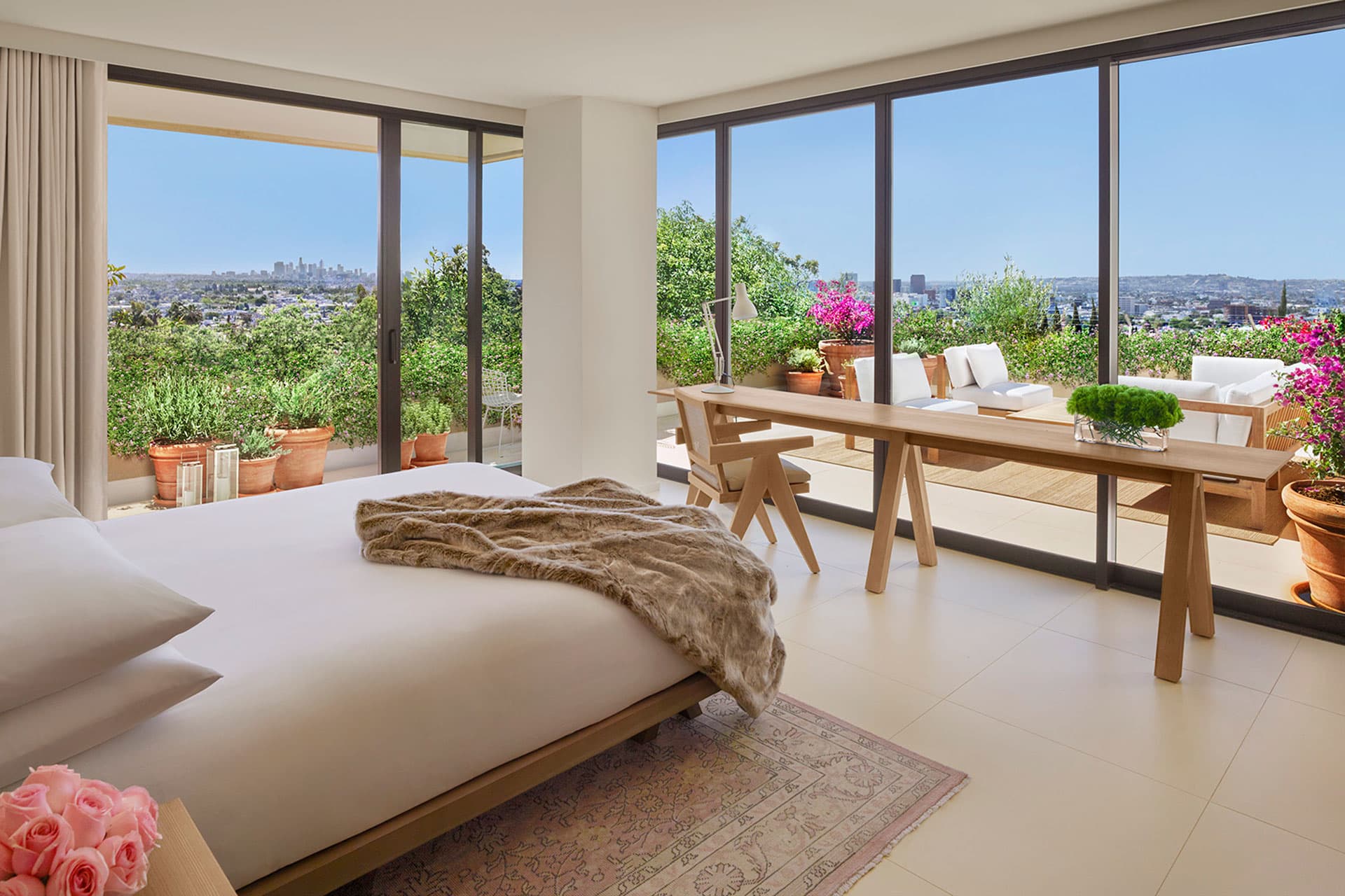 Interior of a Superior Villa Suite at The West Hollywood EDITION hotel, with large windows overlooking the city