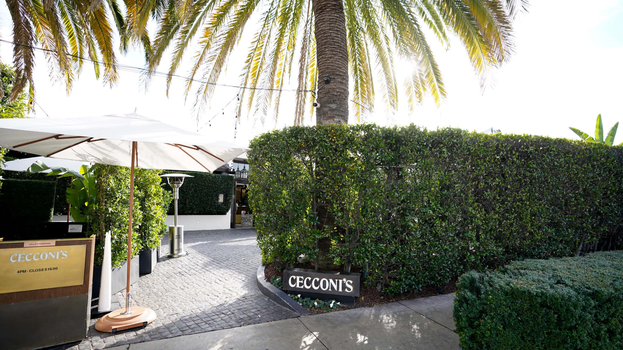The driveway at Cecconi's in the West Hollywood Design District is partially concealed by a privacy hedge.