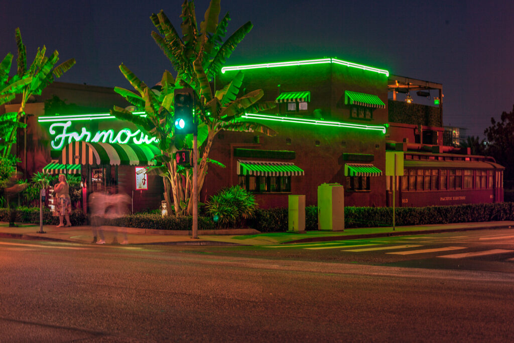 Exterior of The Formosa Cafe in West Hollywood, with its green neon sign.