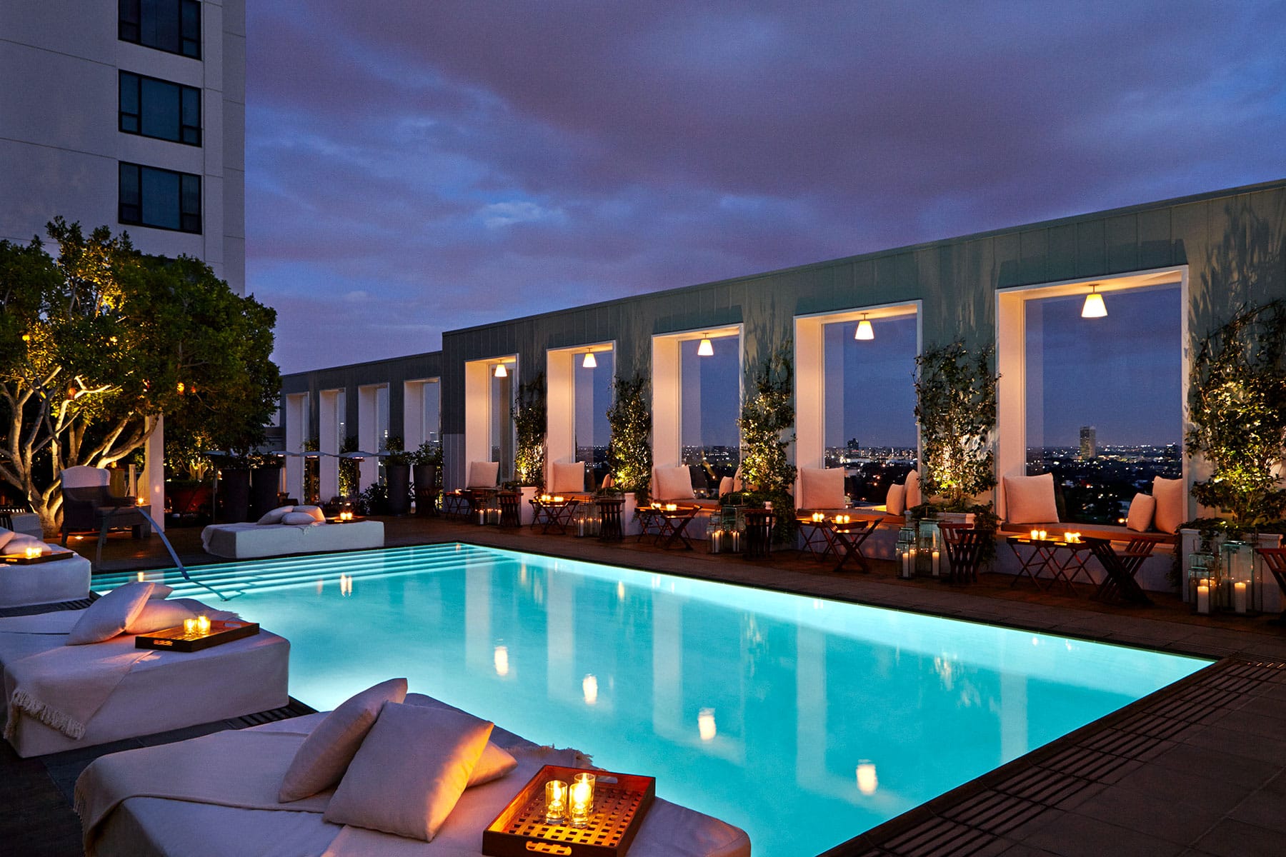 Rooftop pool at Skybar at Mondrian Los Angeles, pictured at twilight.