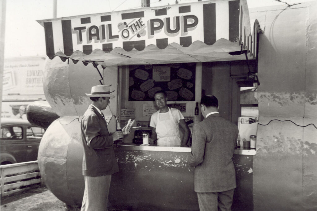 Actor Ralph Richardson at the Tail O' the Pup hot dog stand in West Hollywood