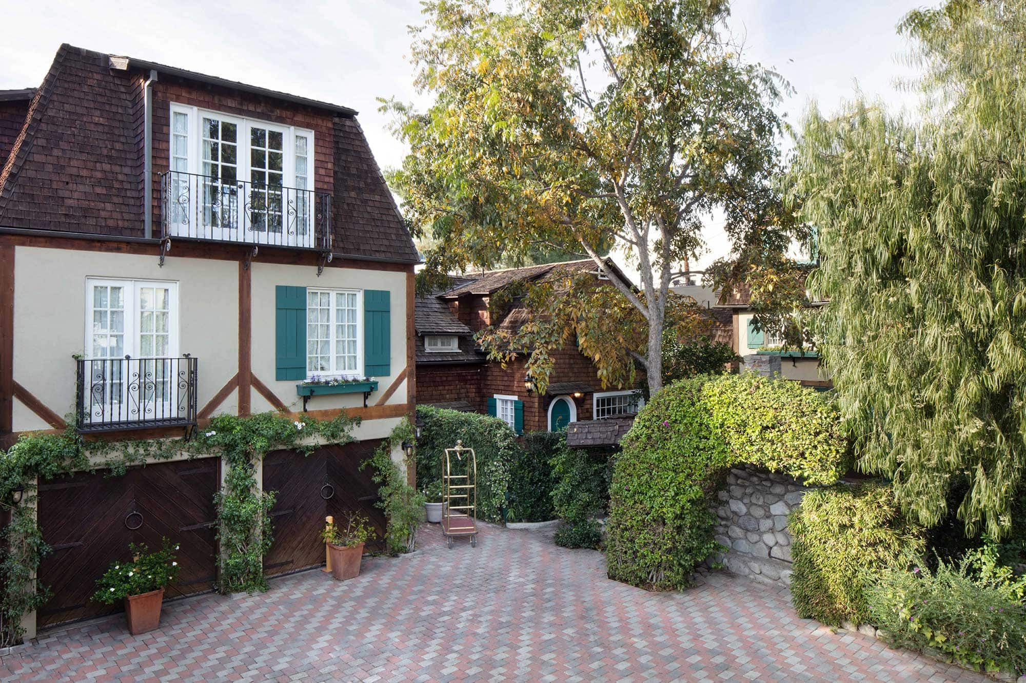 Exterior of The Charlie hotel's courtyard, featuring English-style cottages. West Hollywood, CA.