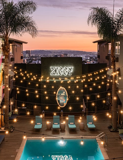 The pool deck at the Hotel Ziggy in West Hollywood is covered with strings of lights.