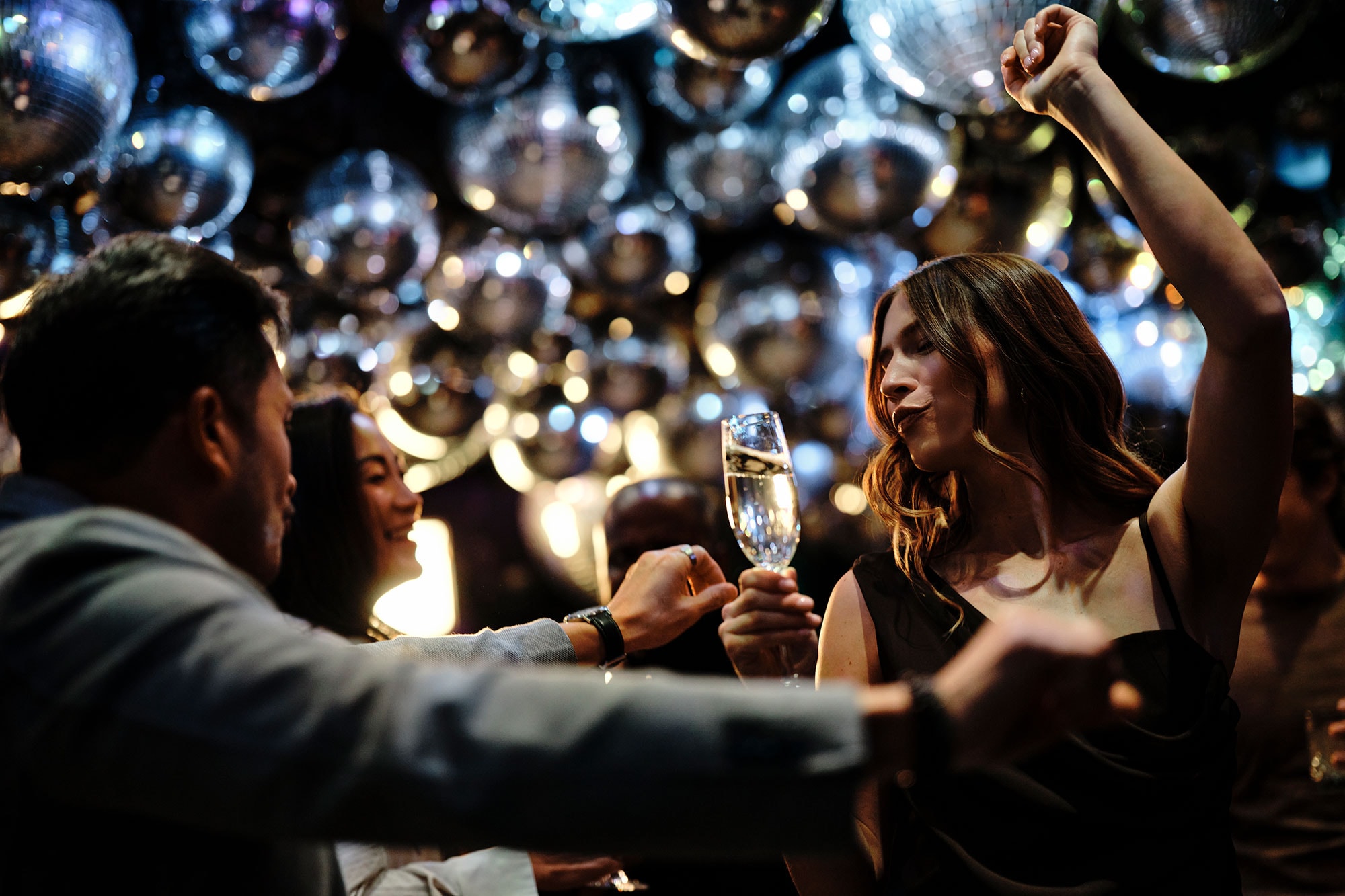 People dance under a ceiling of mirror balls at Sunset nightclub in West Hollywood