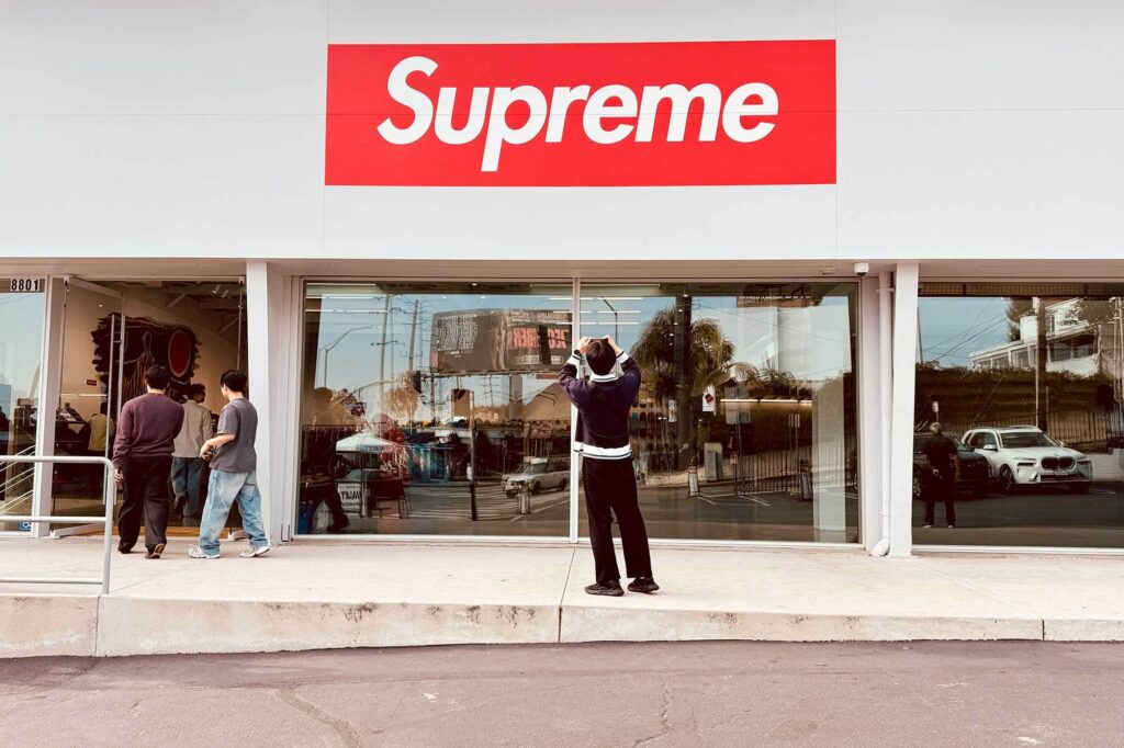 A tourist snaps a photo outside the Supreme store on Sunset Boulevard.