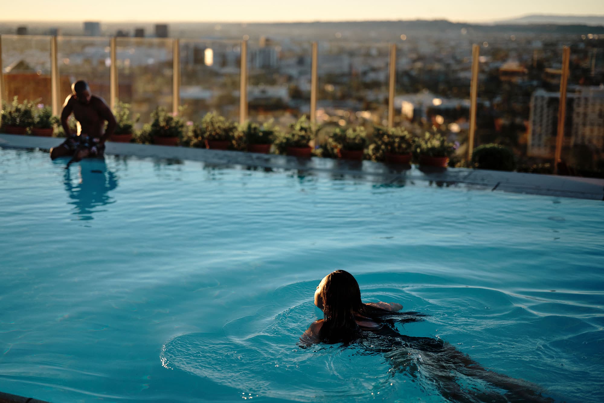 A woman swims in the rooftop pool of The West Hollywood EDITION.