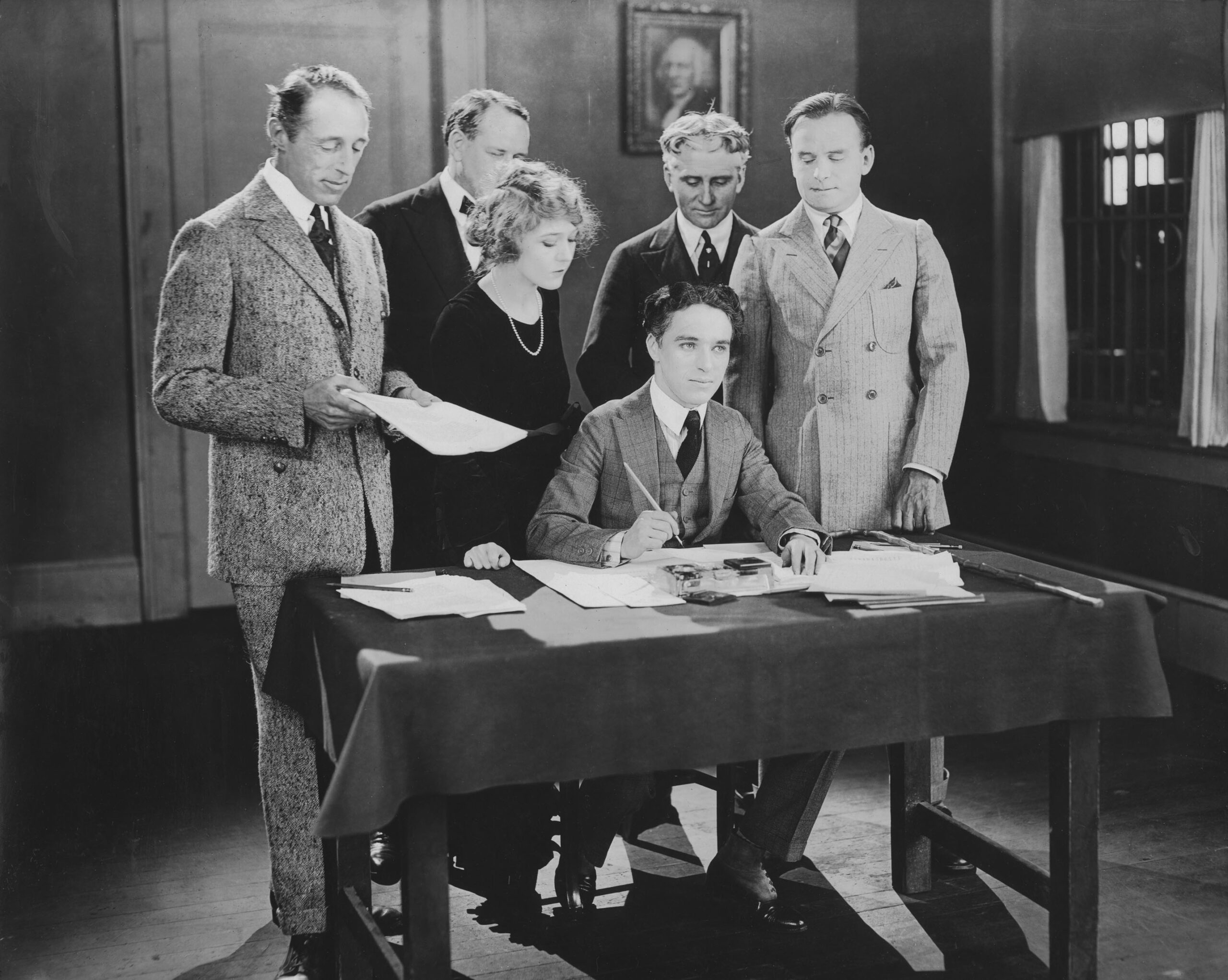 D.W. Griffith, Mary Pickford, Charlie Chaplin and Douglas Fairbanks sign the contract establishing United Artists in 1919.