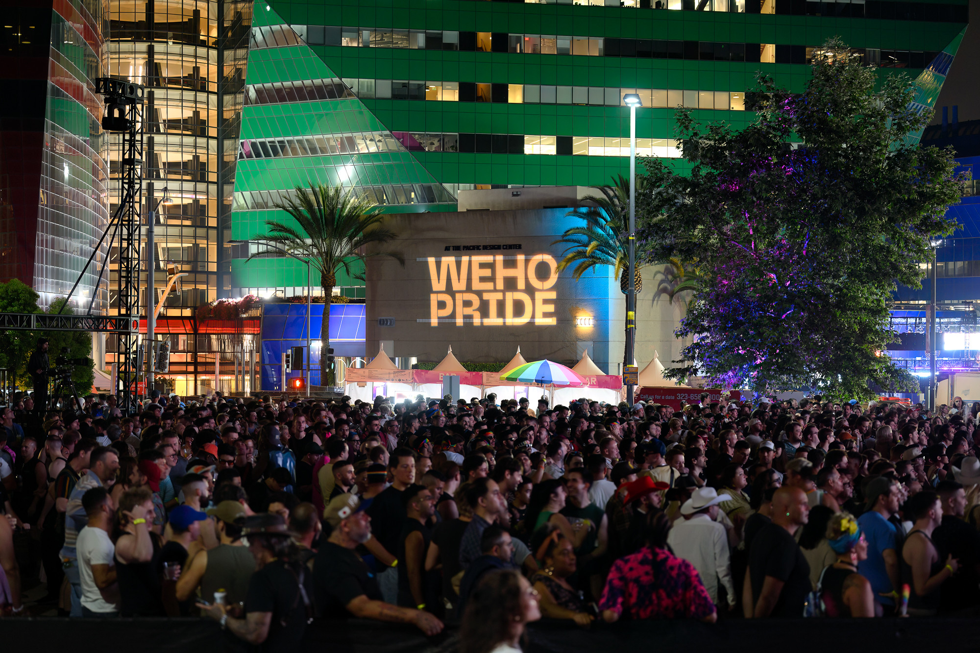 A large crowd gathers at OUTLOUD at WeHo Pride